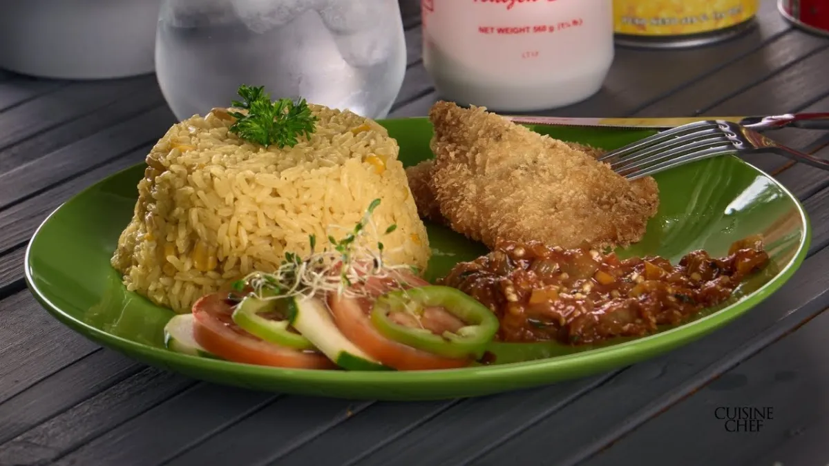 Receta de Aprende hacer de una manera diferente un arroz con maíz, berenjena y pollo empanizado